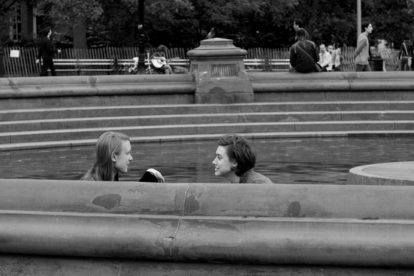Conversation by the fountain pool
